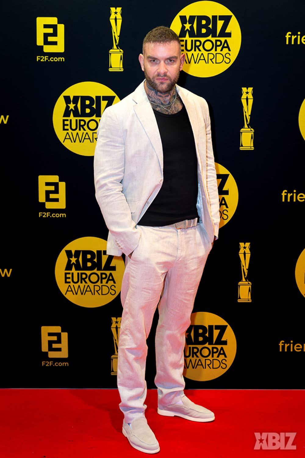 Andy Lee on a red carpet, full-length portrait
